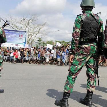 Indonesian soldiers stand guard during a protest in Timika, Papua province, August 21, 2019.