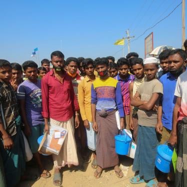 Rohingya refugees stand at the Kutupalong refugee camp, Cox’s Bazar, Bangladesh, April 1, 2020.