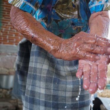 A Zapotec woman washes her hands after learning from a local radio program about hand-washing and social distancing to avoid COVID-19, in Oaxaca state, Mexico, March 31, 2020. 